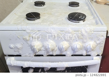 Gas stove filled with anti-grease agent, thorough general cleaning of the kitchen 124822891