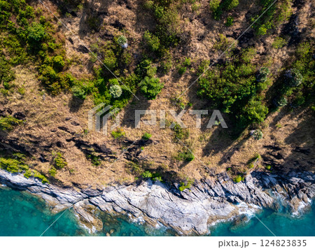 Beautiful seashore nature landscape in phuket Thailand,Amazing landscape waves crashing on rock in summer season background,Wide angle view drone shot 124823835