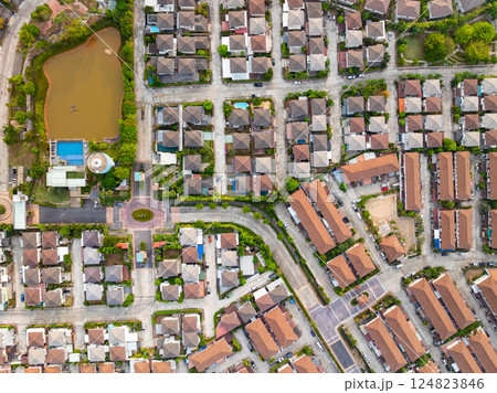 New development real estate. Aerial view of residential houses and driveways neighborhood during a fall sunset or sunrise time. Tightly packed homes. Top view over private houses in phuket thailand 124823846
