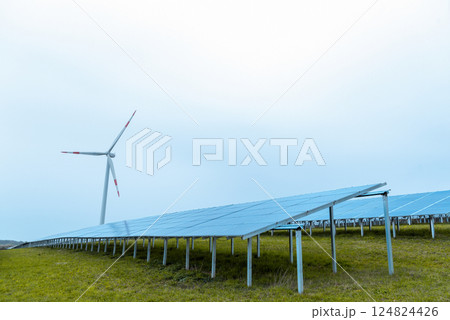 Solar panels and one wind turbine in nature in Germany Solar panels and one wind turbine in nature in Germany 124824426