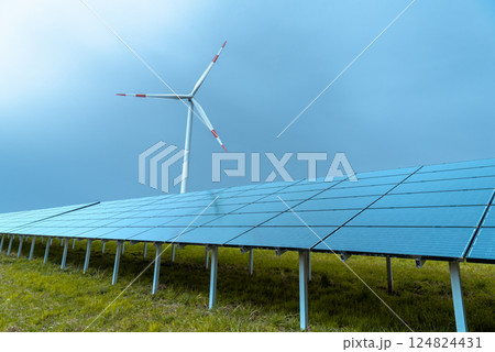 Solar panels farm and a wind turbine in Germany 124824431