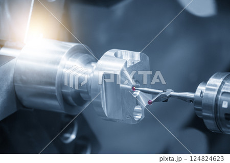 The modular touch probe checking the aluminum shaft parts on CNC lathe machine in the light blue scene. 124824623