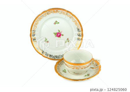 Porcelain vintage cup and saucer isolated on white background. Porcelain vintage cup and saucer isolated on white background. 124825060