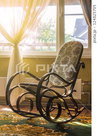 The rocking chair in the living room The rocking chair in the living room 124825705