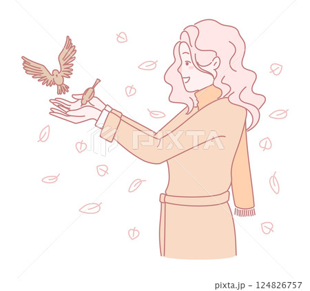 A woman with a bird among vibrant leaves symbolizes freedom and natures beauty 124826757