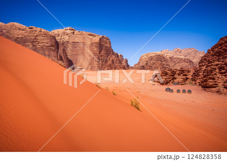 Wadi Rum, Jordan. Red Sand Dunes are stunning, wind-sculpted dunes with deep red hues. 124828358