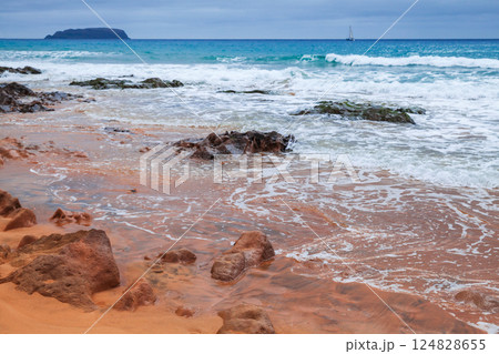 Landscape of Porto Santo, Portugal. A serene coastal scene with red rocks 124828655
