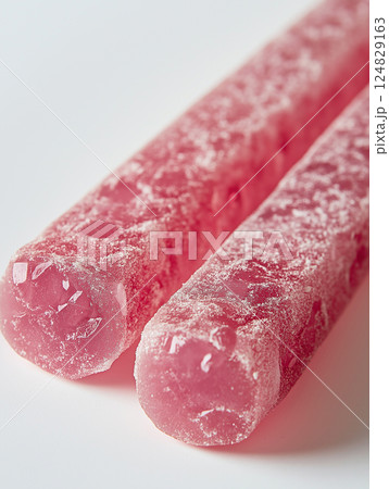 Bright pink candy with sweet sugar texture and frosted crystal ice, a refreshing treat. 124829163