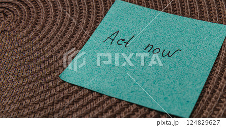 Reminder note on a textured surface encouraging immediate action 124829627
