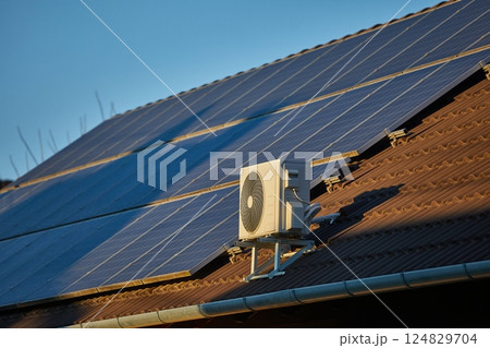 Air-conditioner exterior unit on solar roof 124829704