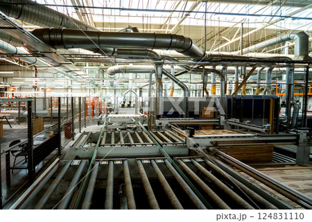 Production line of the wooden floor factory. CNC automatic woodworking machine. 124831110