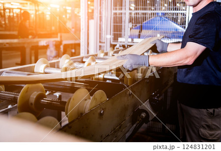 Carpenter with fibreboards at furniture factory workshop. Woodworking industry 124831201