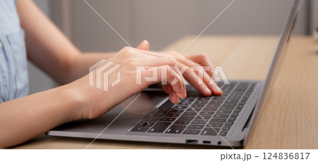Young caucasian woman sitting and using laptop computer planning for success in modern office. Young caucasian woman sitting and using laptop computer planning for success in modern office. 124836817