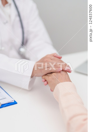 doctor holding hands with elderly female patient, showing empathy and support during a medical consultation. trust, Senior and geriatric care, healthcare, Mental Health, giving advice and emotional doctor holding hands with elderly female patient, showing empathy and support during a medical consultation. trust, Senior and geriatric care, healthcare, Mental Health, giving advice and emotional 124837600