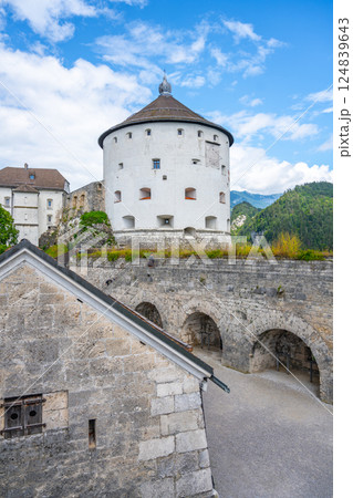 Visitors enjoy breathtaking views from Kufstein Fortress in Tyrol, Austria. The historic site showcases remarkable architecture and stunning mountain landscapes on a clear day. 124839643