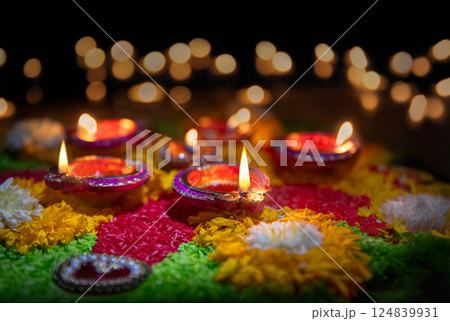 Clay diya lamps lit during diwali celebration, Diwali, or Dipawali, is India's biggest and most important holiday. 124839931