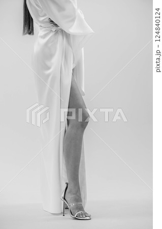 Elegant Female Figure in Silk Robe Highlighting Feminine Beauty and Grace 124840124