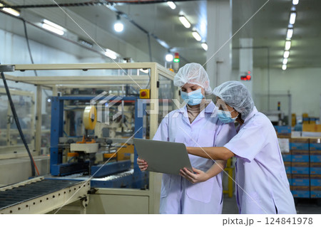 Quality control team inspecting production line in food factory 124841978