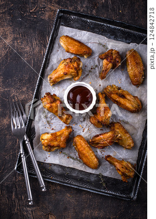 Baked roasted chicken wings with sauce Baked roasted chicken wings with sauce 124842718