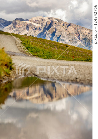 Dolomites, Italy mountains reflection in the water 124842756