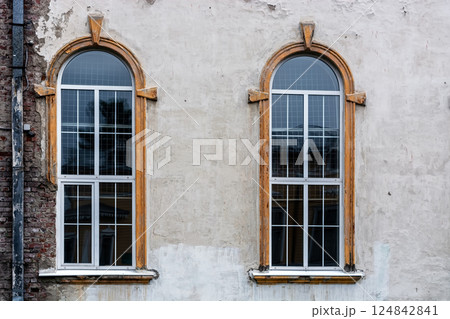 Two windows on the old wall. Two windows on the old wall. 124842841