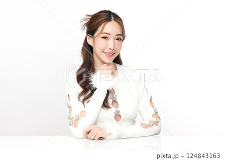 A beautiful young Asian woman with clean, fresh skin against a white background. Skincare, facial treatment, cosmetology, beauty, and spa. An elegant portrait of an Asian woman. A beautiful young Asian woman with clean, fresh skin against a white background. Skincare, facial treatment, cosmetology, beauty, and spa. An elegant portrait of an Asian woman. 124843163