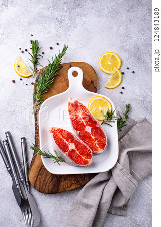 Raw uncooked salmon with rosemary Raw uncooked salmon with rosemary 124843189