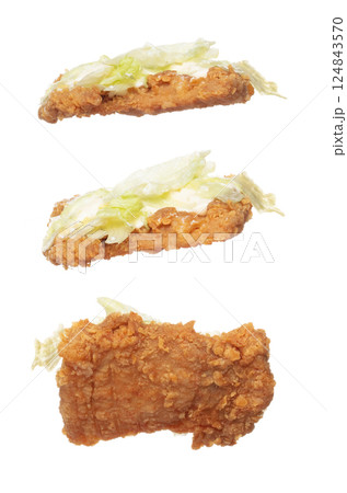 Fried Chicken Burger fly explosion, Chicken Burgers vegetable fall down. Hot bread chicken burger fast food throw splash in air. White background Isolated high speed shutter, freeze action Fried Chicken Burger fly explosion, Chicken Burgers vegetable fall down. Hot bread chicken burger fast food throw splash in air. White background Isolated high speed shutter, freeze action 124843570