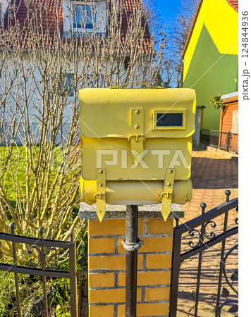Yellow Mailbox on Brick Post, Suburban Scene, Sunny Day, Residential Area. High quality photo 124844936