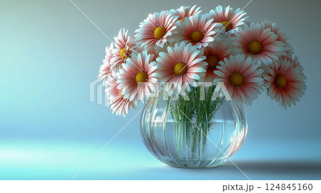 A fresh bouquet of daisy flowers with dew drops on the petals stands in a glass vase against a light background A fresh bouquet of daisy flowers with dew drops on the petals stands in a glass vase against a light background 124845160