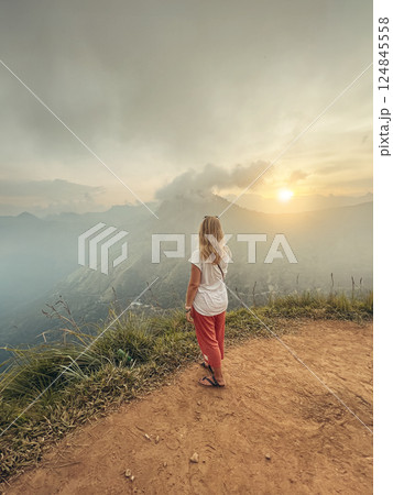 Blonde woman and sunset at Little Adam's Peak, Sri Lanka Blonde woman and sunset at Little Adam's Peak, Sri Lanka 124845558