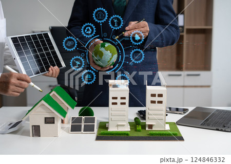 Two colleagues discussing data sustainable development with renewable energy solutions, ecology concept, green business. Two colleagues discussing data sustainable development with renewable energy solutions, ecology concept, green business. 124846332