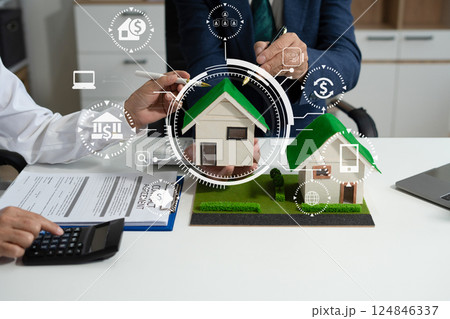 House model with agent asking costumer for contract to buy, get insurance or loan real estate or property. 124846337