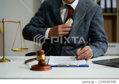 Lawyer singing in documents, filling court records, job responsibilities in office. 124846346
