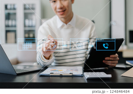 Calendar and agenda scheduling concept. Businessman using digital tablet and Laptop with calendar planner and organizer to plan and reminder, schedule, event planning. Calendar and agenda scheduling concept. Businessman using digital tablet and Laptop with calendar planner and organizer to plan and reminder, schedule, event planning. 124846484