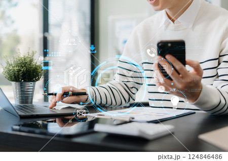 Copyright or patent concept, Person hand using laptop computer, tablet and smartphone with virtual screen copyright icon trademark, Creation ownership against piracy at office. 124846486