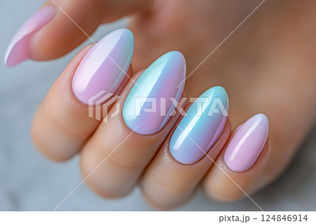 Stylish pastel nail design showcasing ombre effect with pink and blue hues, perfect for spring occasions and trendy nail art enthusiasts Stylish pastel nail design showcasing ombre effect with pink and blue hues, perfect for spring occasions and trendy nail art enthusiasts 124846914