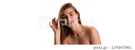 Banner. Beautiful woman with brush, combing her thick neat against white background with negative space to insert text. Banner. Beautiful woman with brush, combing her thick neat against white background with negative space to insert text. 124847961