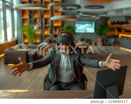 Business portrait rich corporate Caucasian man business suit outstretched arms sitting desk office wearing VR headset glasses. Reality using technology work. Concept using modern technology 124848317