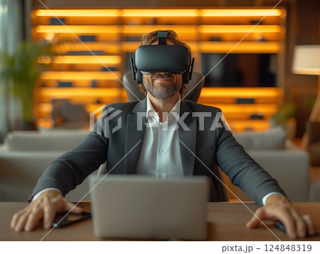 Business portrait rich corporate Caucasian man business suit outstretched arms sitting desk office wearing VR headset glasses. Reality using technology work. Concept using modern technology 124848319