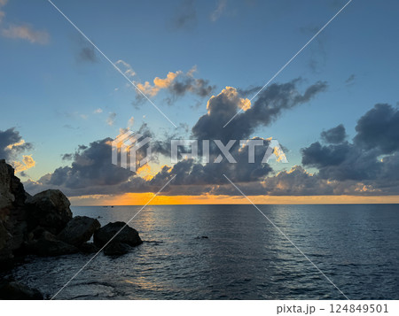 landscape, stones, rocks and the sea at sunset 124849501