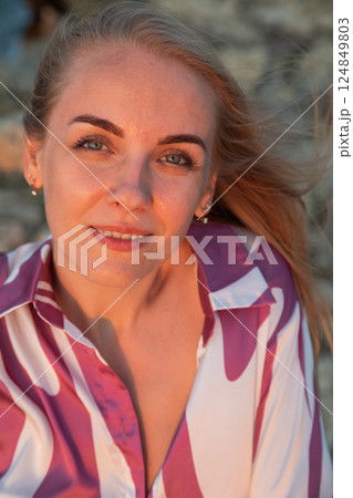 Beautiful slender blonde woman in silk suit 124849803