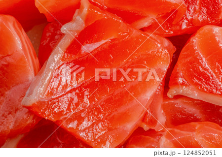 Pieces of salmon fish as a background macro photo. 124852051