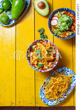 Delicious tortilla fried Aztec soup with chalupas and fresh ingredients perfect for Mexican celebrations 124852057