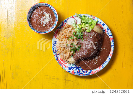 Mexican cuisine with mole poblano chicken with rice Mexican cuisine with mole poblano chicken with rice 124852061