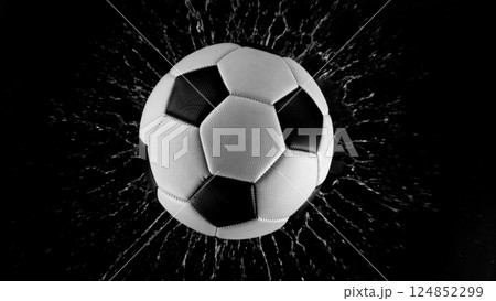 Detail of soccer ball with splashing water. Isolated on black background. Detail of soccer ball with splashing water. Isolated on black background. 124852299