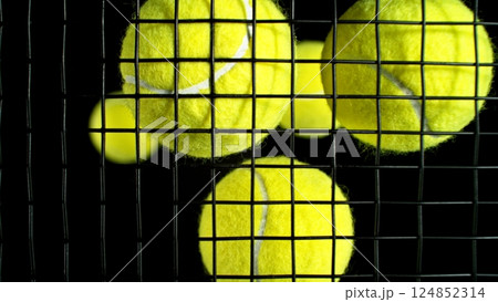 Tennis balls on rocket strings. 124852314