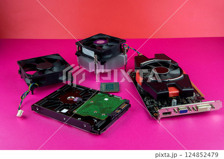 Used Computer Components Arranged on a Coloured Base and Background 124852479