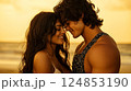 Couple shares a tender moment on the beach at sunset, creating a magical atmosphere filled with love and joy 124853190