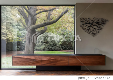 Modern interior design featuring natural elements and a large window view of a tree 124853852